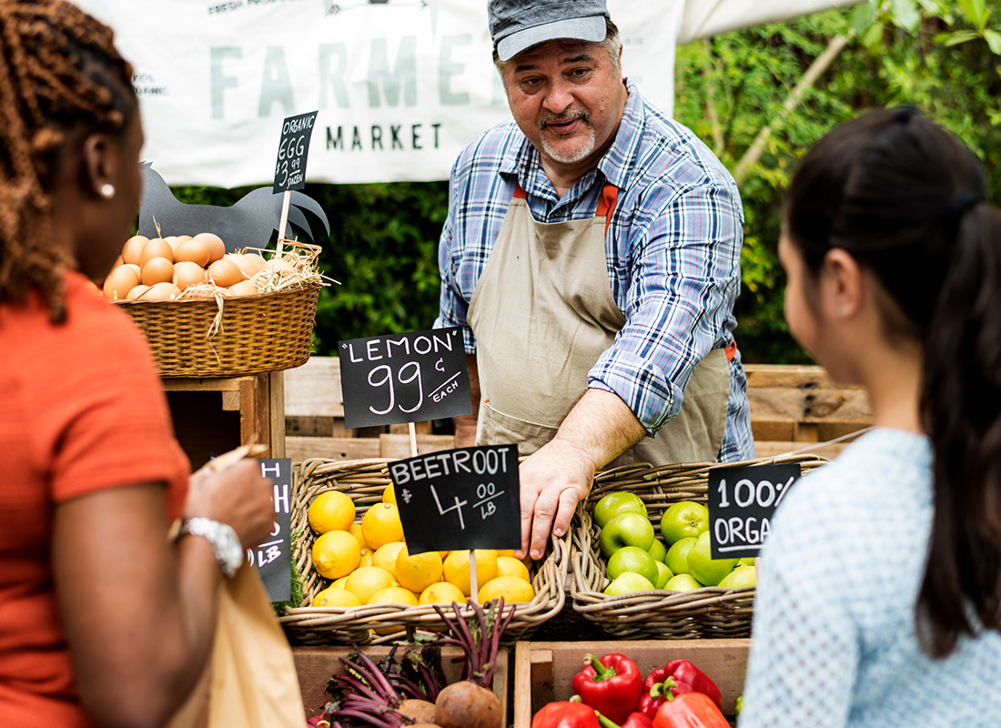 Business Insurance - Customers Buying Produce at a Farmers Market